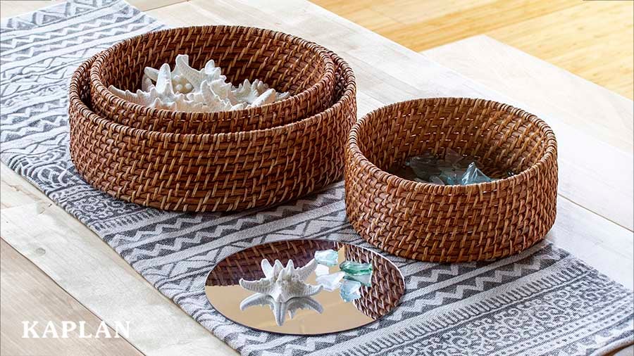 An image of the Sense of Place Woven Mirror Trays, one contains white seashells and the other contains blue and green sea glass.  