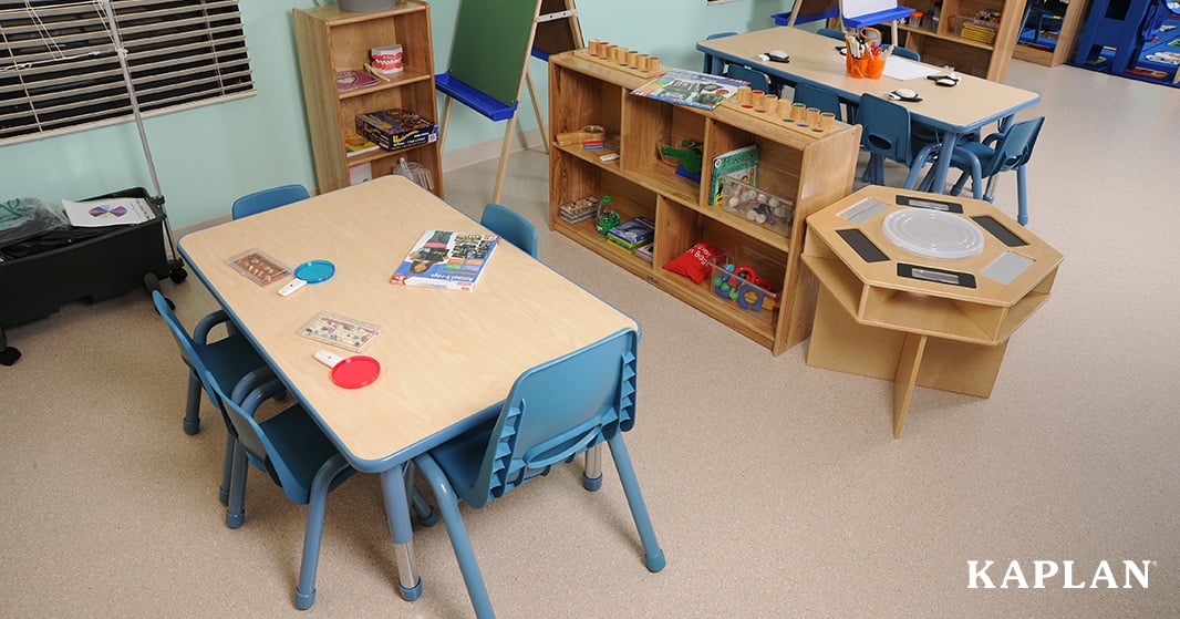 A classroom activity table with adjustable legs made bright and cheerful with blue color edge bands and coordinating blue chairs.