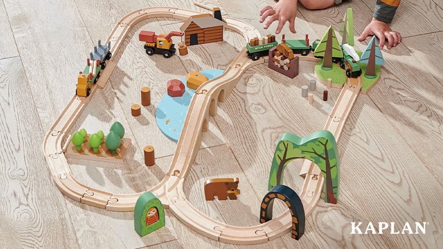 An image of the Wild Pines Wooden Train Set on a hardwood floor surface. 