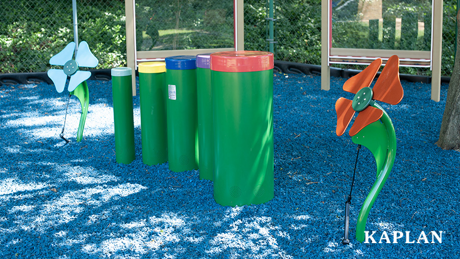 An image of an early childhood playground featuring Tuned Drums and Toddler Musical Flowers. 