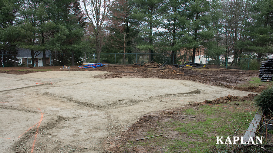 A future playground site grated and leveled for playground equipment installation.