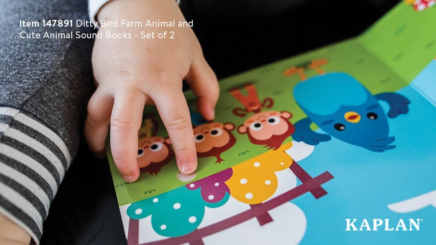 An image of an infant's hand touching a bumpy circle patch inside a Ditty Bird story book. 