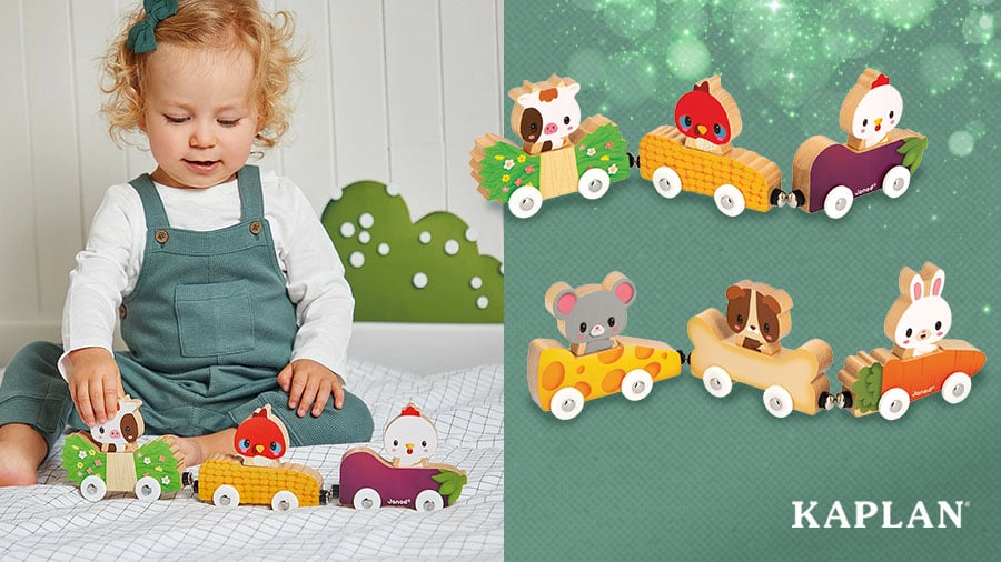 A young child sits on the floor, a set of Mix and Match Magnetic Animal Cars is on the floor in front of them.