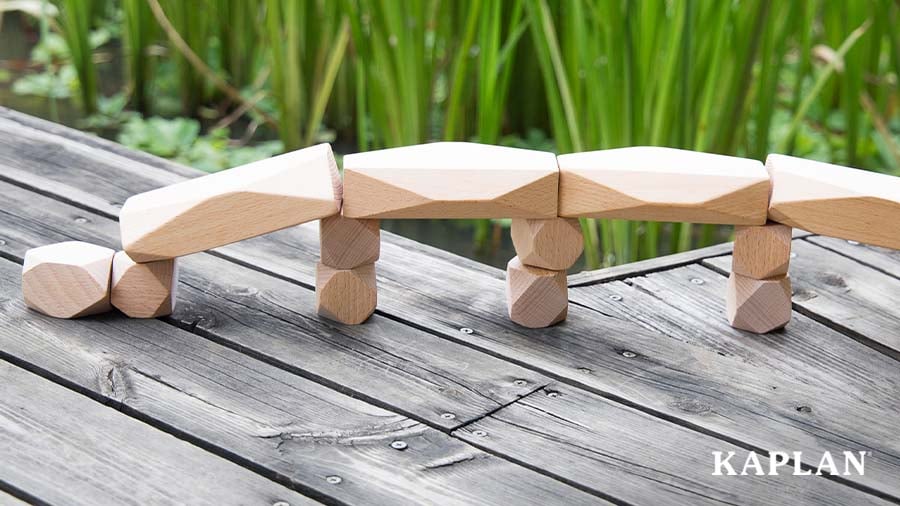 Block structure placed on a wooden outdoor table