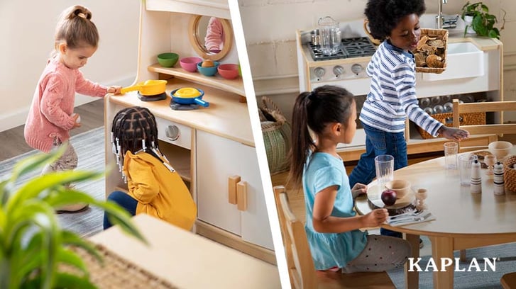 An image showing children playing in the dramatic play learning center in their early childhood classroom. The picture shows children playing on the Sense of Place Kitchen. 