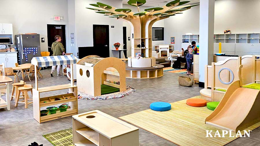 Children and parents explore the Goodwill Excel Center's drop-in child care space.