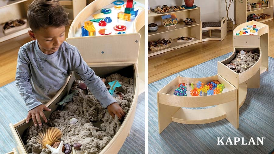 A child uncovers a seashell in a sand tray which is part of the Carolina Connections Discovery Tables. 