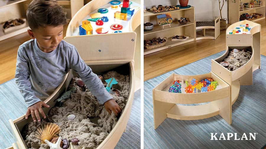 A child uncovers a seashell in a sand tray which is part of the Carolina Connections Discovery Tables.