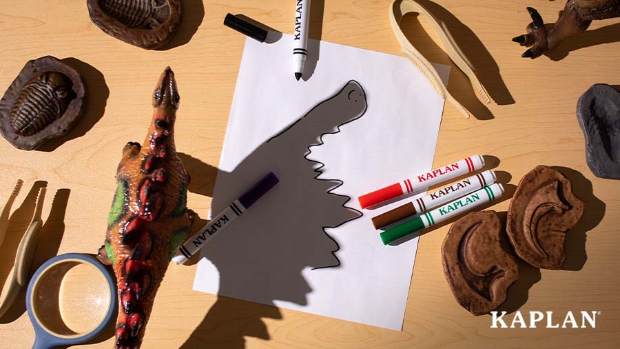 An image of a dinosaur toy casting a shadow on a blank sheet of paper. 