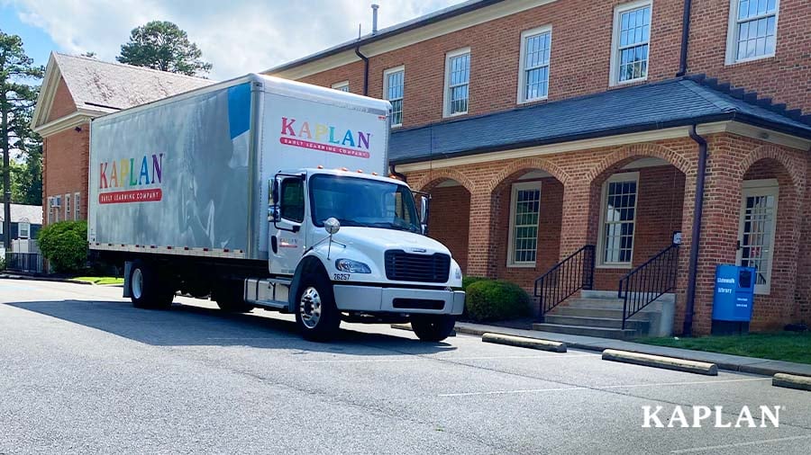 A Kaplan delivery truck parks in front of the entrance to the Tuckahoe Montessori school in Virginia. 
