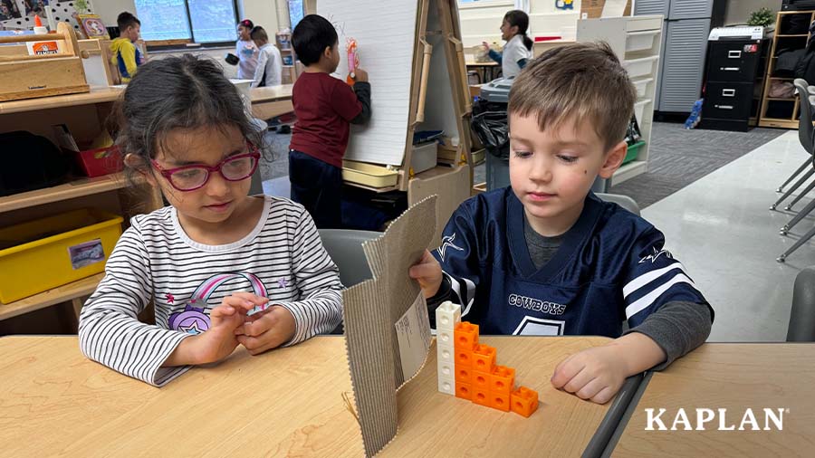 Two children are using Connect4Learning math manipulatives to count and sort. 