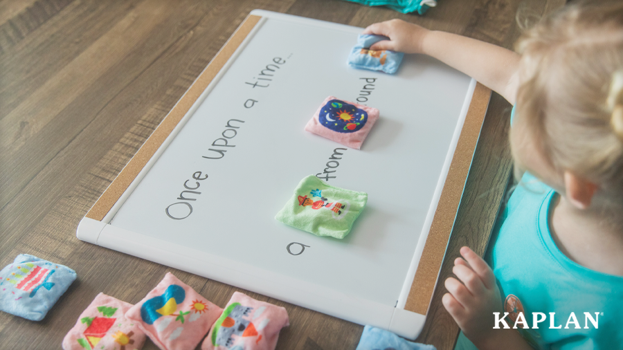 Young child crafting a simple story using Storytelling Bean Bags