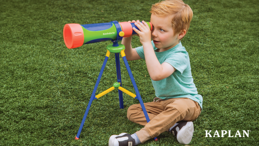 Young child exploring nature with his Geosafari Jr. My First Telescope