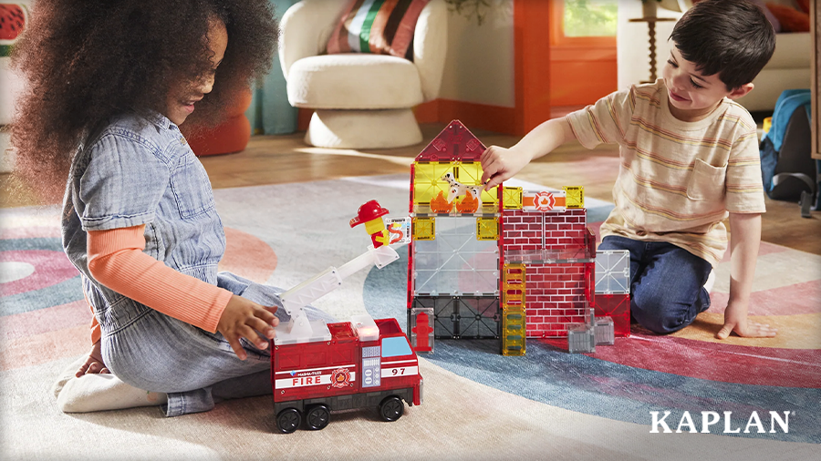Two young children playing with the MAGNA-TILES Fire Station with Lights & Sounds