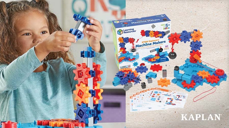 Young child stacking gears next to the STEM Explorers Machine Makers set and box