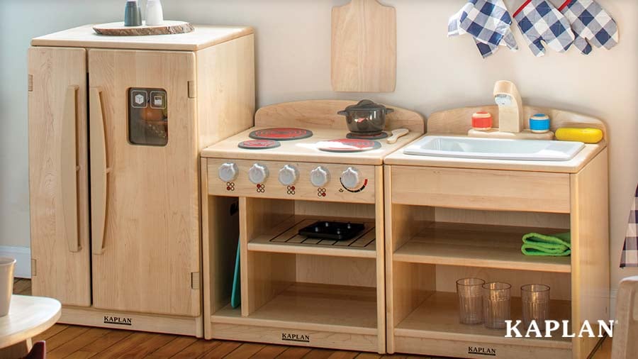 Close-up of a natural wood Kaplan play kitchen set