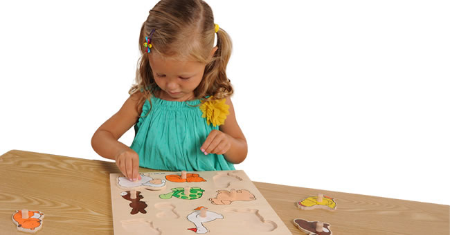 Little pre-school girl learns to solve puzzles online and plays educational  games on tablet at home - a Royalty Free Stock Photo from Photocase