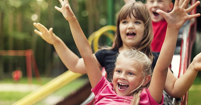 happy kids playing in playground