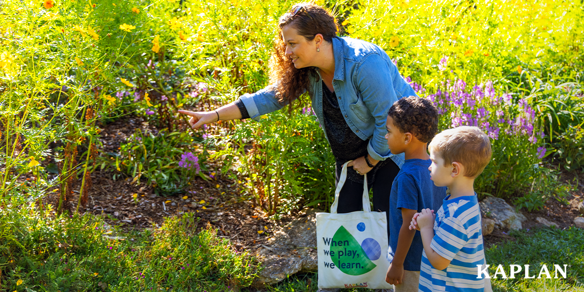 Featured image: An early childhood teacher points at an insect flying in a field of flowers, two young children are standing beside the teacher, looking in the direction she is pointing.  - Read full post: 3 Nature-Themed Activities to Enrich Your Preschool Math and Literacy Lessons