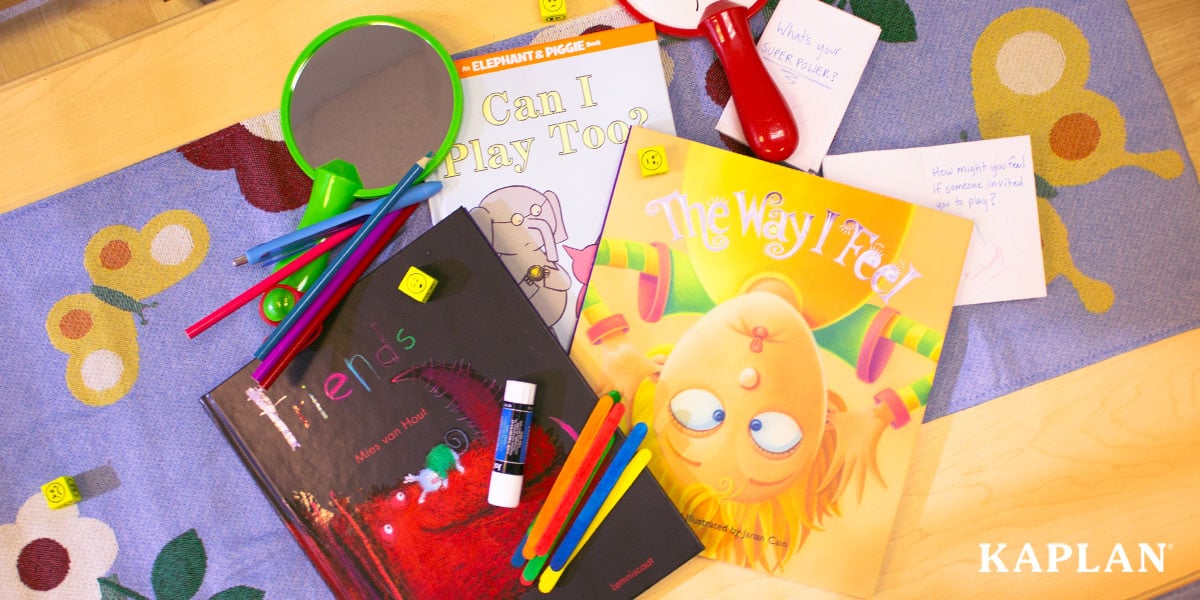 Featured image: An image showing several children's books and classroom manipulatives that feature social and emotional development topics.  - Read full post: 4 Activities To Promote Social and Emotional Development in the Preschool Classroom