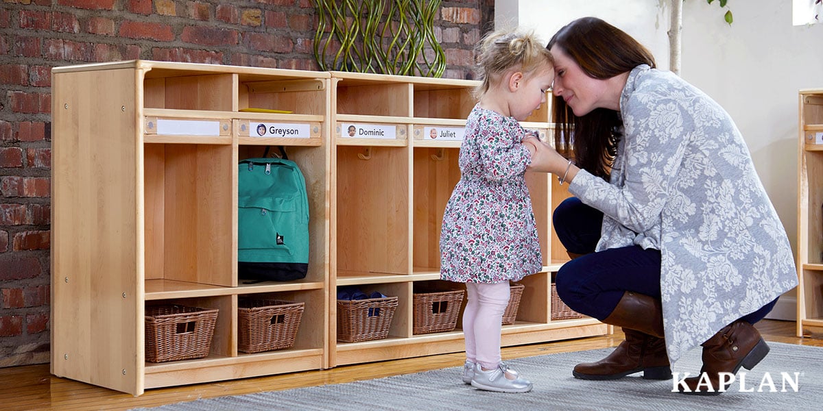 Featured image: Early childhood educator comforting toddler during morning drop-off - Read full post: 5 Simple Activities To Ease Transitions For The New School Year
