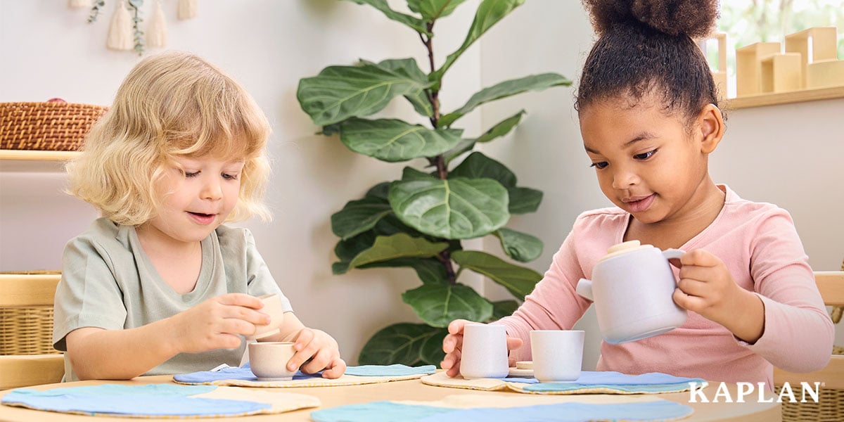 Featured image: Two children sitting at a table playing tea party - Read full post: How To Support Autonomy In The Early Childhood Classroom