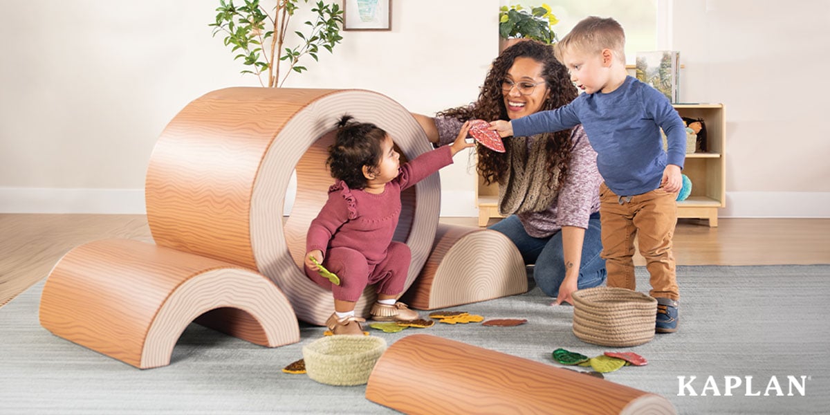 Featured image: Two young children playing with manipulatives with early childhood educator - Read full post: How to Engage Infants to Boost Their Physical Development
