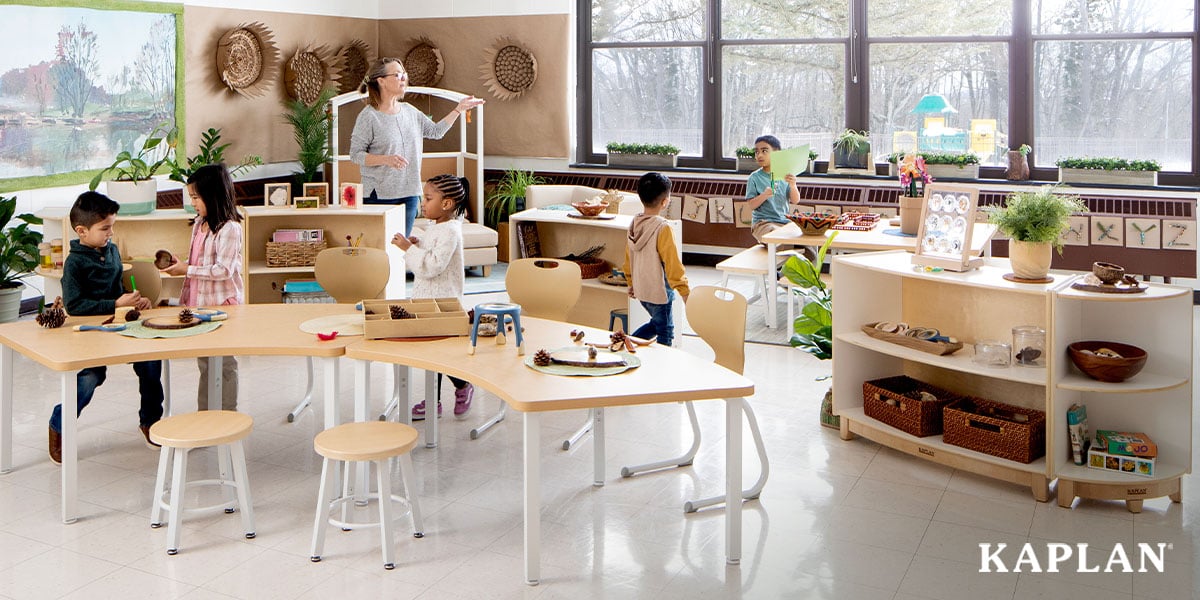 Featured image: An early elementary teacher stands in front of a classroom featuring the Sense of Place for Elementary furniture collection. Children are walking around the room as they make their way to different learning centers.  - Read full post: Introducing the Sense of Place Furniture Collection For Early Elementary Classrooms